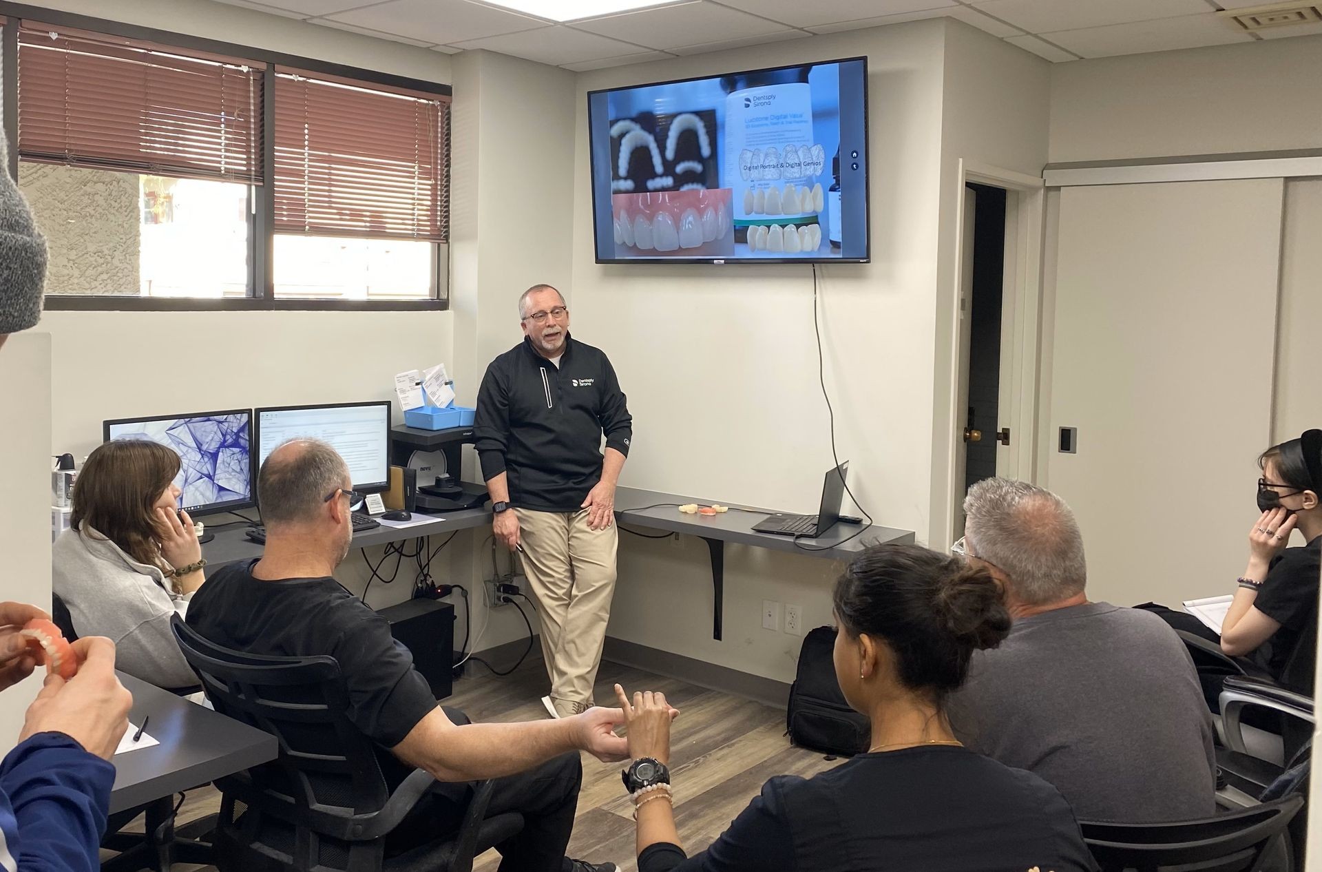 Consulting with a group of Dentists